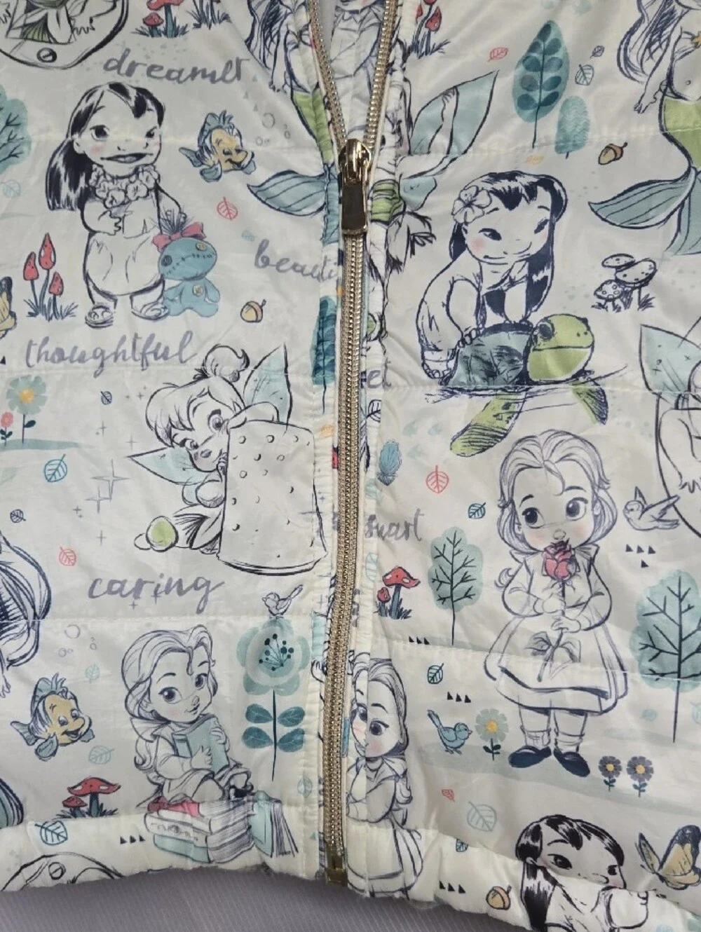 Disney Quilted Puffer Jacket with Cream Background and Pastel Accents